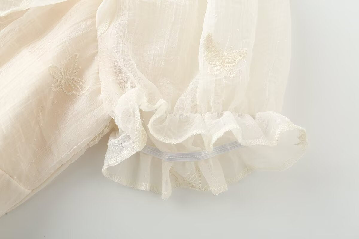 Irregular short sleeved dress with ruffled edges