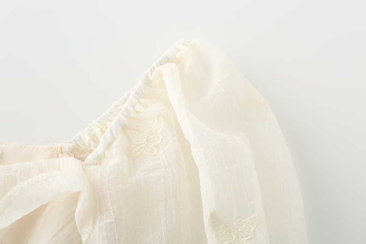 Irregular short sleeved dress with ruffled edges